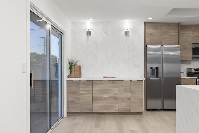4143 Cole Way, San Diego, CA 92117 - kitchen featuring stainless steel appliances, light countertops, light wood finished floors, and recessed lighting