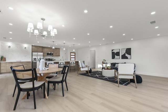 4143 Cole Way, San Diego, CA 92117 - dining room with recessed lighting, light wood-style flooring, and a chandelier