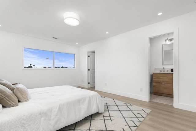 4143 Cole Way, San Diego, CA 92117 - bedroom featuring light wood finished floors, recessed lighting, wet bar, and connected bathroom