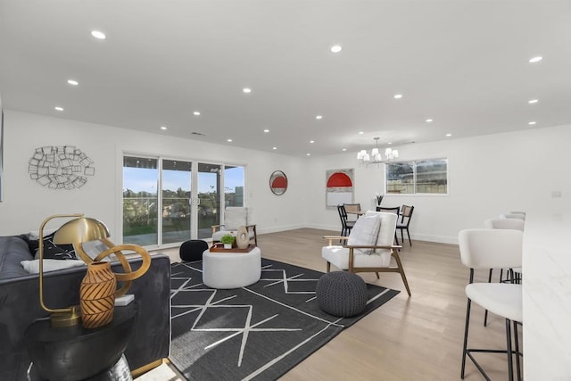 4143 Cole Way, San Diego, CA 92117 - living room featuring recessed lighting, light wood finished floors, healthy amount of natural light, and a chandelier