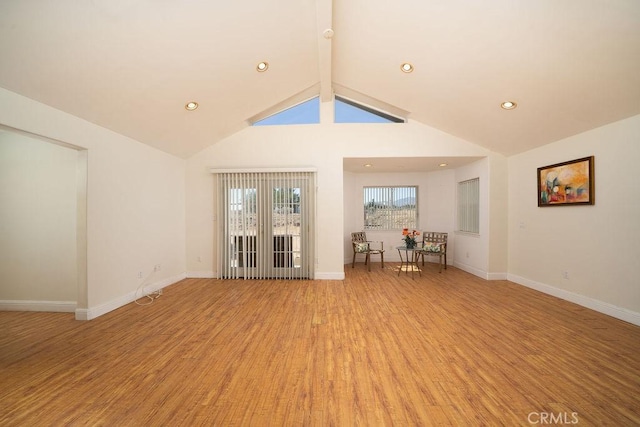 8851 Sonora Rd, Phelan, CA 92371 - unfurnished living room with light wood-style flooring, beamed ceiling, recessed lighting, and high vaulted ceiling
