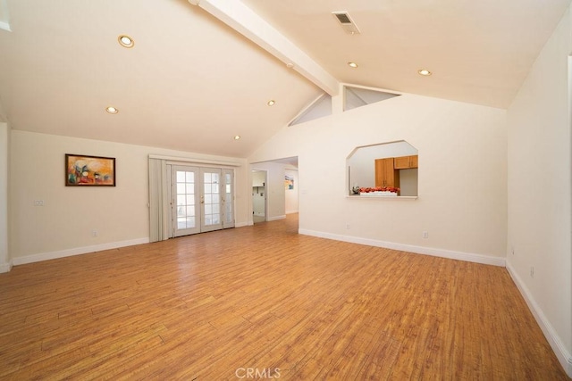 8851 Sonora Rd, Phelan, CA 92371 - unfurnished living room featuring beam ceiling, light wood-type flooring, french doors, recessed lighting, and high vaulted ceiling