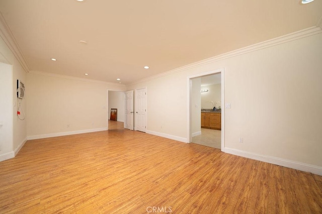8851 Sonora Rd, Phelan, CA 92371 - spare room with light wood finished floors, ornamental molding, and recessed lighting
