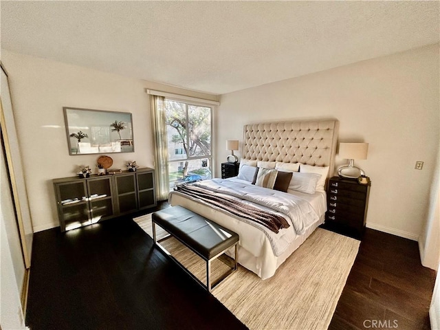 4242 Stansbury Ave Unit 203, Sherman Oaks, CA 91423 - bedroom featuring wood finished floors and a textured ceiling