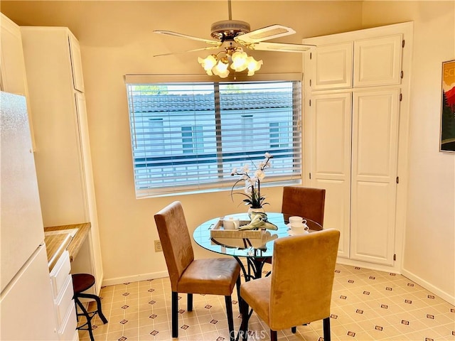 4242 Stansbury Ave Unit 203, Sherman Oaks, CA 91423 - dining room featuring ceiling fan and baseboards