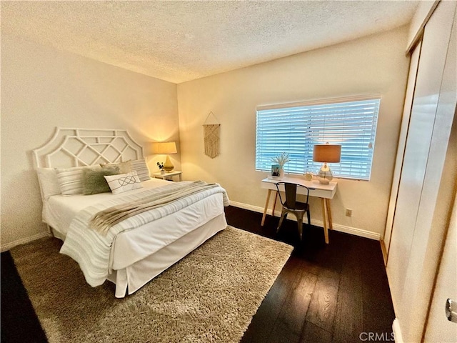 4242 Stansbury Ave Unit 203, Sherman Oaks, CA 91423 - bedroom featuring a textured ceiling and dark wood-type flooring