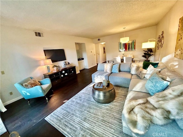 4242 Stansbury Ave Unit 203, Sherman Oaks, CA 91423 - living area featuring wood finished floors and a textured ceiling