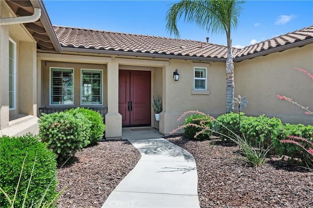 41798 Aviv Ct, Murrieta, CA 92562 - view of exterior entry featuring stucco siding and a tile roof