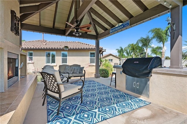 41798 Aviv Ct, Murrieta, CA 92562 - view of patio with area for grilling, an outdoor living space with a fireplace, a gazebo, and ceiling fan