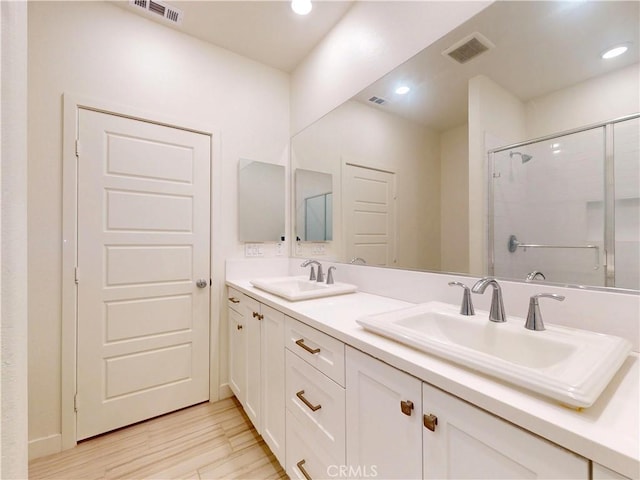 2603 Winston Ct, Arcadia, CA 91007 - full bath featuring double vanity, a shower stall, wood finished floors, and recessed lighting