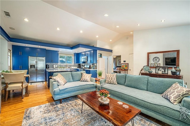 8638 Yorktown Ave, Los Angeles, CA 90045 - living room featuring light wood-type flooring, recessed lighting, and vaulted ceiling