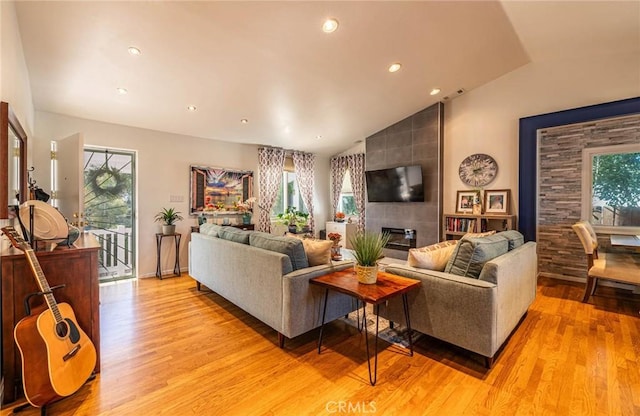 8638 Yorktown Ave, Los Angeles, CA 90045 - living room featuring light wood-style floors, vaulted ceiling, and recessed lighting