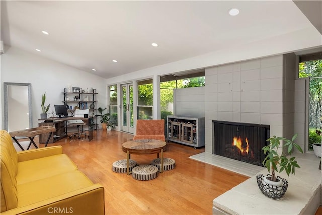 2911 Walker Lee Dr, Rossmoor, CA 90720 - living area with wood finished floors, a desk, recessed lighting, vaulted ceiling, and a fireplace
