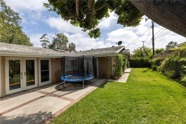 2911 Walker Lee Dr, Rossmoor, CA 90720 - view of yard with french doors, a trampoline, and a patio area