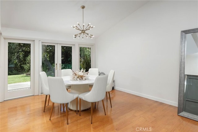 2911 Walker Lee Dr, Rossmoor, CA 90720 - dining area featuring french doors, a chandelier, light wood finished floors, and lofted ceiling