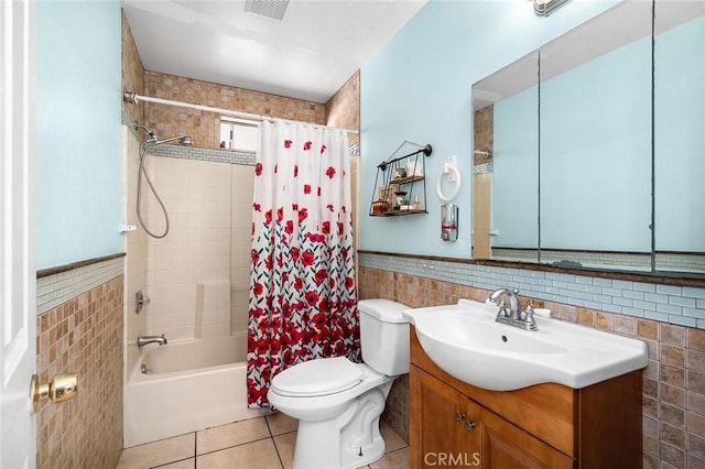 117 N Morada Ave, West Covina, CA 91790 - full bathroom featuring tile walls, tile patterned floors, vanity, shower / tub combo, and a wainscoted wall