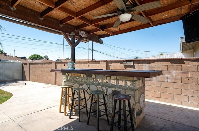 117 N Morada Ave, West Covina, CA 91790 - fenced backyard with ceiling fan, a patio area, and a storage unit