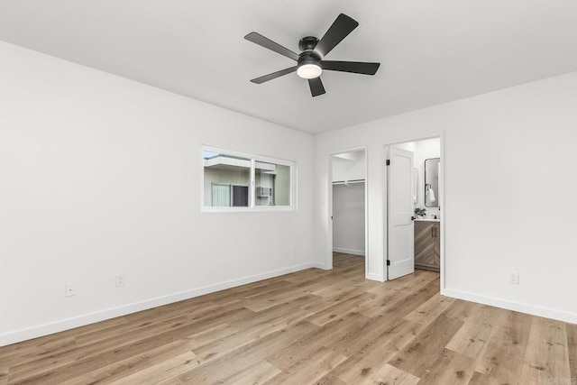 4514 Dawson Ave Unit 2, San Diego, CA 92115 - unfurnished bedroom with light wood-type flooring, a walk in closet, ensuite bath, and ceiling fan