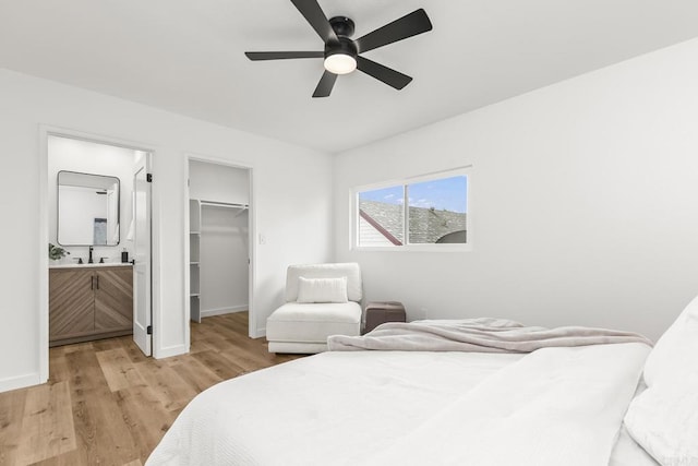 4514 Dawson Ave Unit 2, San Diego, CA 92115 - bedroom with a spacious closet, light wood finished floors, connected bathroom, and a ceiling fan