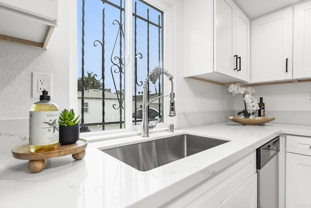 4514 Dawson Ave Unit 4, San Diego, CA 92115 - kitchen featuring stainless steel dishwasher, healthy amount of natural light, white cabinetry, a textured wall, and light stone counters