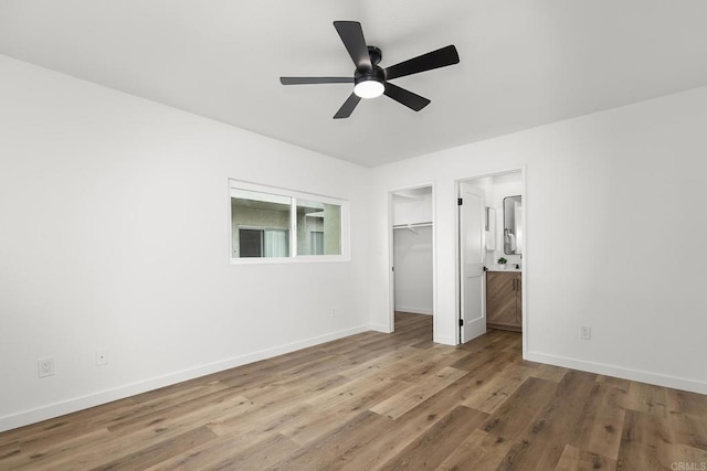 4514 Dawson Ave Unit 4, San Diego, CA 92115 - unfurnished bedroom featuring wood finished floors, a spacious closet, ensuite bath, and ceiling fan