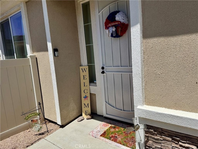 19642 Castle Harbor Ct, Apple Valley, CA 92308 - view of exterior entry featuring stucco siding