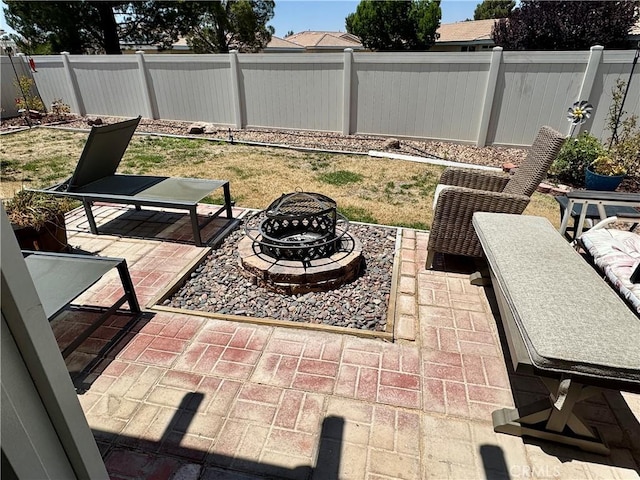 19642 Castle Harbor Ct, Apple Valley, CA 92308 - fenced backyard with an outdoor fire pit and a patio area