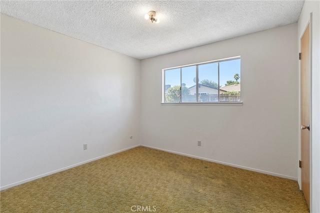 2151 W Pico Ave, Fresno, CA 93705 - unfurnished room with carpet floors and a textured ceiling