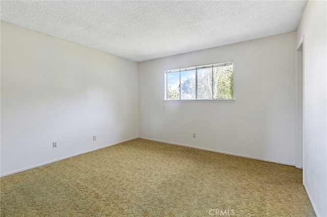 2151 W Pico Ave, Fresno, CA 93705 - unfurnished room featuring carpet flooring and a textured ceiling
