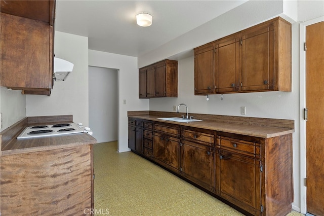 2151 W Pico Ave, Fresno, CA 93705 - kitchen featuring exhaust hood, stovetop, and light flooring