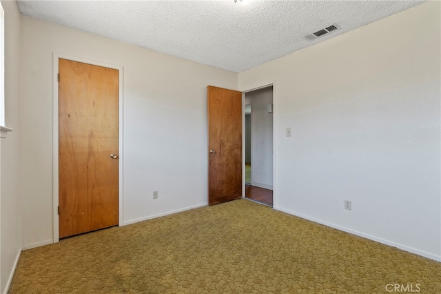 2151 W Pico Ave, Fresno, CA 93705 - unfurnished bedroom featuring carpet floors and a textured ceiling