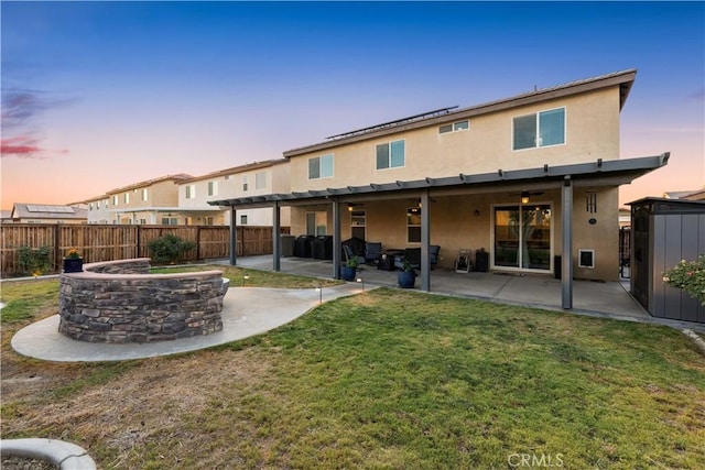 3558 Mt San Gorgonia Ave, Rosamond, CA 93560 - rear view of property featuring stucco siding, a fenced backyard, and a patio area