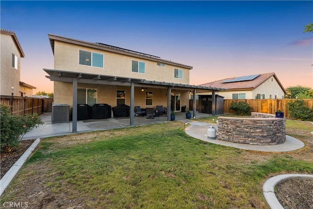 3558 Mt San Gorgonia Ave, Rosamond, CA 93560 - back of house with stucco siding, a fenced backyard, and a patio area