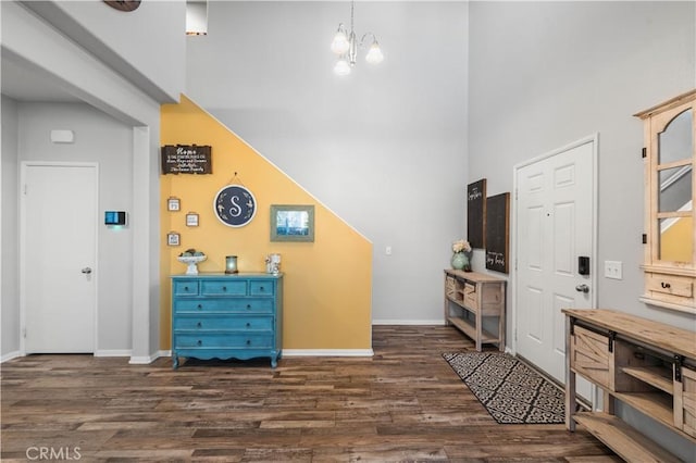 3558 Mt San Gorgonia Ave, Rosamond, CA 93560 - foyer with a towering ceiling, dark wood-type flooring, and a chandelier