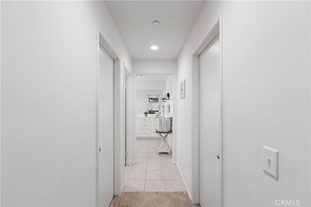 3558 Mt San Gorgonia Ave, Rosamond, CA 93560 - corridor featuring light tile patterned flooring, light colored carpet, and recessed lighting