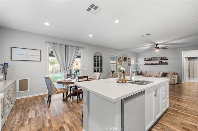 3558 Mt San Gorgonia Ave, Rosamond, CA 93560 - kitchen with stainless steel dishwasher, light countertops, light wood finished floors, plenty of natural light, and recessed lighting