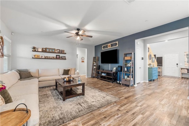 3558 Mt San Gorgonia Ave, Rosamond, CA 93560 - living room featuring ceiling fan and light wood-type flooring