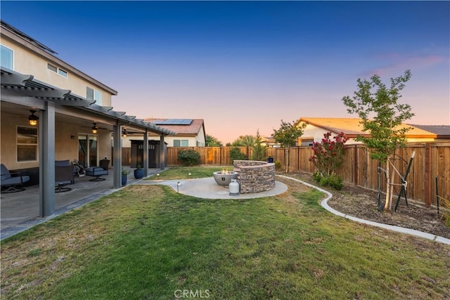 3558 Mt San Gorgonia Ave, Rosamond, CA 93560 - yard at dusk with a pergola, a patio, a fenced backyard, and ceiling fan
