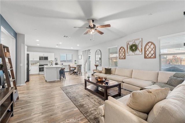 3558 Mt San Gorgonia Ave, Rosamond, CA 93560 - living room with a ceiling fan, light wood-style flooring, and recessed lighting