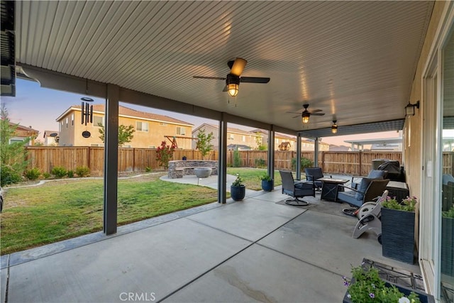 3558 Mt San Gorgonia Ave, Rosamond, CA 93560 - fenced backyard featuring a patio, outdoor lounge area, and a ceiling fan