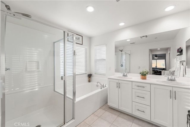 3558 Mt San Gorgonia Ave, Rosamond, CA 93560 - bathroom featuring a stall shower, a bath, tile patterned floors, a ceiling fan, and recessed lighting