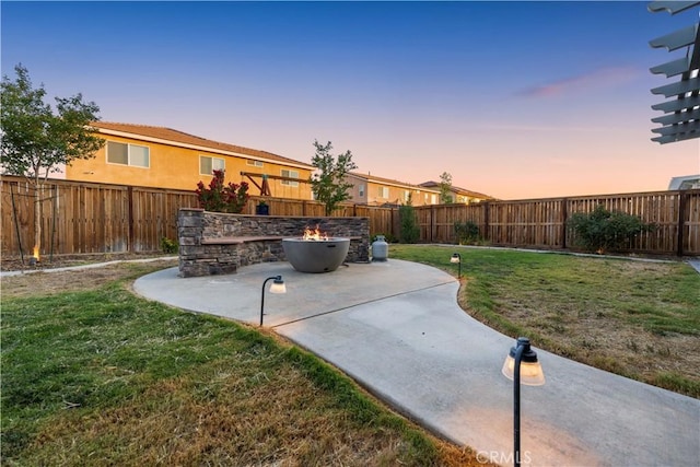 3558 Mt San Gorgonia Ave, Rosamond, CA 93560 - yard at dusk featuring a patio area and a fenced backyard