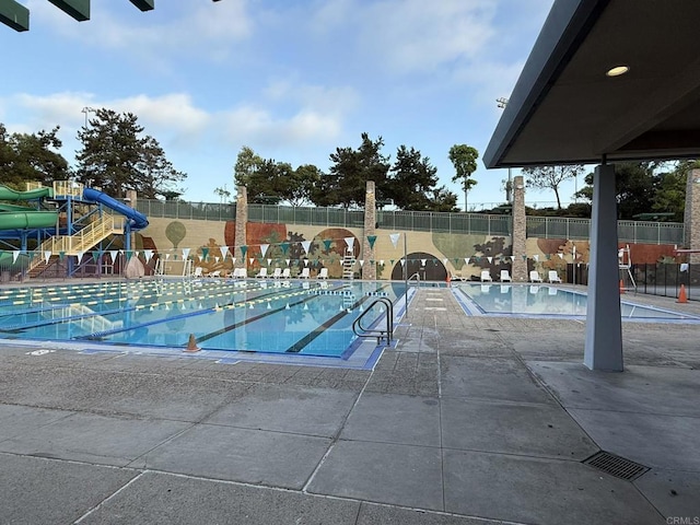 3887 Pell Pl Unit 134, San Diego, CA 92130 - community pool with a water slide and a patio
