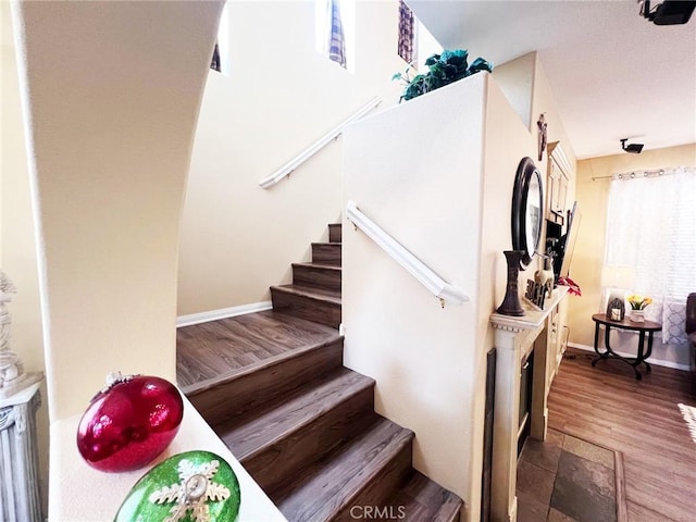 28303 Sycamore Dr, Saugus, CA 91350 - stairs featuring baseboards and wood finished floors
