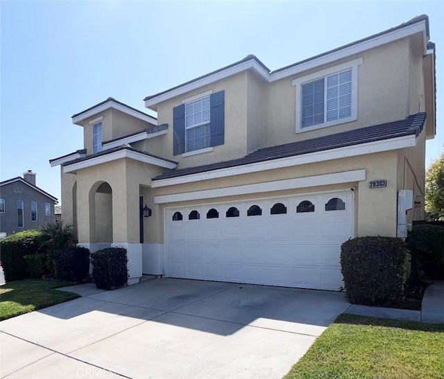 28303 Sycamore Dr, Saugus, CA 91350 - traditional home with a garage, concrete driveway, and stucco siding