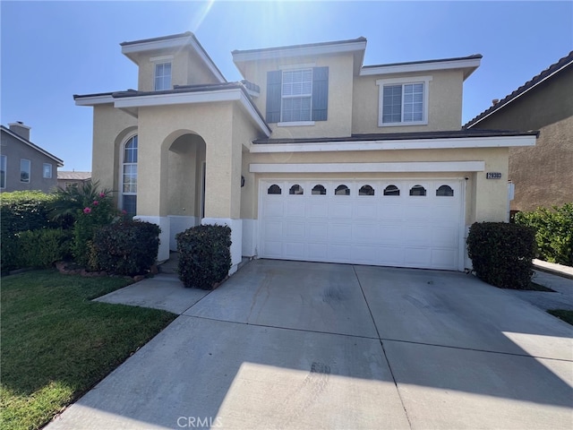 28303 Sycamore Dr, Saugus, CA 91350 - traditional-style house with stucco siding, concrete driveway, and a garage