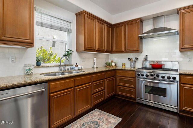 274 S Prospect Ave, Tustin, CA 92780 - kitchen featuring stainless steel appliances, wall chimney range hood, dark wood finished floors, light stone counters, and tasteful backsplash