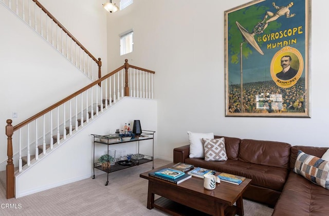 274 S Prospect Ave, Tustin, CA 92780 - carpeted living area featuring stairway and a towering ceiling