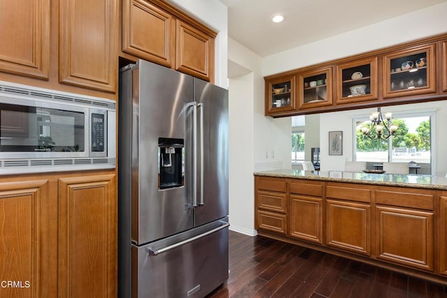 274 S Prospect Ave, Tustin, CA 92780 - kitchen featuring stainless steel appliances, brown cabinetry, glass insert cabinets, and recessed lighting