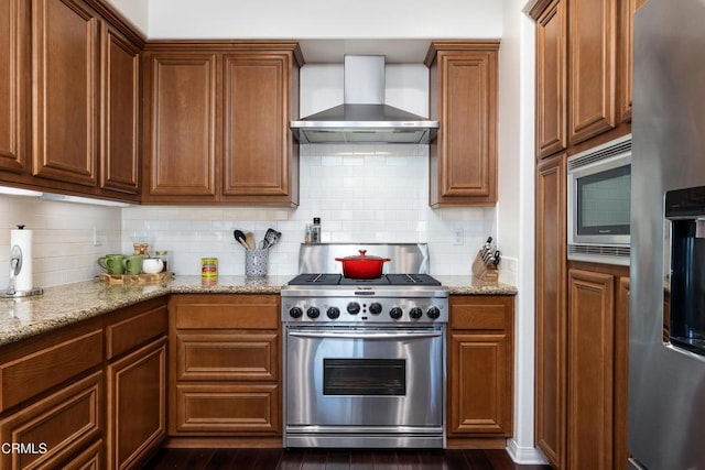 274 S Prospect Ave, Tustin, CA 92780 - kitchen with wall chimney range hood, stainless steel appliances, light stone countertops, and backsplash